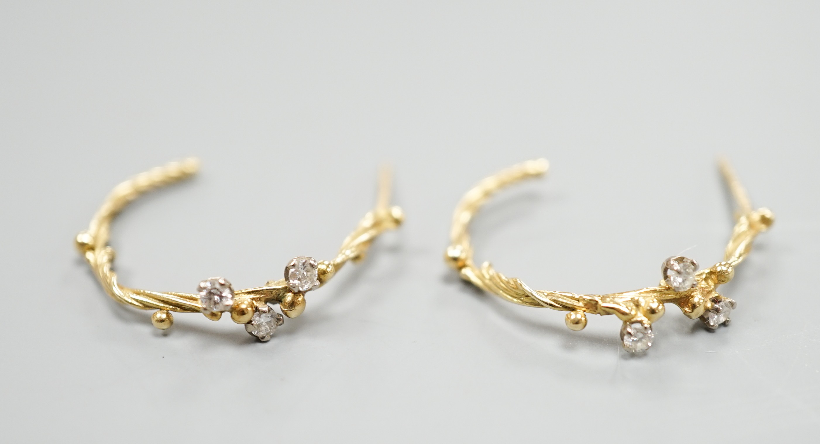 A pair of 18ct gold and three stone diamond set rustic hoop earrings, no butterflies, 25mm, gross weight 3.5 grams.